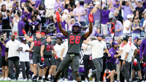 Oct 15, 2022; Fort Worth, Texas, USA; TCU Horned Frogs safety Bud Clark (26) celebrates his interception during the second half against the Oklahoma State Cowboys at Amon G. Carter Stadium. Mandatory Credit: Raymond Carlin III-USA TODAY Sports